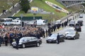 President of Ukraine Petro Poroshenko greeting people, cars and bodyguards nearby. Military parade