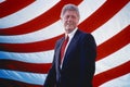President William Jefferson Clinton in front of American flag stripes Royalty Free Stock Photo