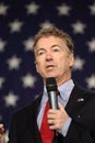 Presidential hopeful Rand Paul speaking in front of stars on American flag