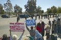 Presidential Motorcade with President George W. Bush past anti-Bush political rally with signs that read Impeach Bush in Tucson