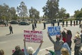 Presidential Motorcade with President George W. Bush past anti-Bush political rally with signs that read Impeach Bush in Tucson