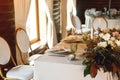 Presidium table setting with empty wine glasses and candles