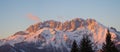 Presolana is a mountain range of the Orobie, Italian Alps. Landscape in winter. At sunset the rocks become red, orange and pink Royalty Free Stock Photo