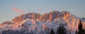 Presolana is a mountain range of the Orobie, Italian Alps. Landscape in winter. At sunset the rocks become red, orange and pink Royalty Free Stock Photo