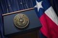 Press conference of governor of the state of Texas concept. Big Seal of the State of Texas on the tribune with flag of USA and