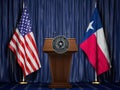 Press conference of governor of the state of Texas concept. Big Seal of the State of Texas on the tribune with flag of USA and Royalty Free Stock Photo