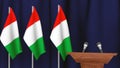 Press conference of premier minister of Italy concept, Politics of Italy. Podium speaker tribune with Italy flags and coat arms. Royalty Free Stock Photo