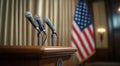 Press conference setup for political event with microphones and American flag displayed in background Royalty Free Stock Photo