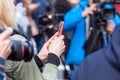 Press or news conference, mobile journalist filming media event with a smartphone Royalty Free Stock Photo