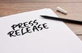 Press release handwritten on a white sheet of paper Royalty Free Stock Photo
