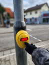 press the traffic light button When crossing a crosswalk. Royalty Free Stock Photo
