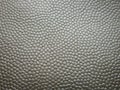 Pressed artificial leather as background or texture. Royalty Free Stock Photo