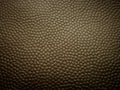 Golden artificial leather for backgrounds. Royalty Free Stock Photo