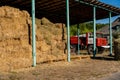 Pressed briquettes of hay near the fire truck