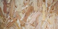 Pressed glued laminated wood chips plywood board abstract background wooden glue texture