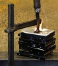 Pressed hard drives with clamp and fire