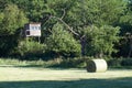 Pressed hay in round bales. Dried grass collected in the meadow. Royalty Free Stock Photo