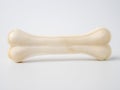 Pressed rawhide bone shaped dog chews.