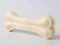 Pressed rawhide bone shaped dog chews.