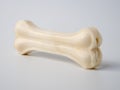 Pressed rawhide bone shaped dog chews.