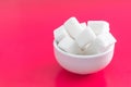 Pressed sugar cubes in a ceramic Cup Royalty Free Stock Photo