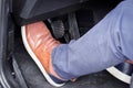 Pressing the clutch in the car, Foot pressing the pedal, Starting the car Royalty Free Stock Photo