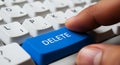 Pressing the Delete Button on a Computer Keyboard with Finger Royalty Free Stock Photo