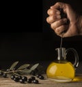 Pressing of olives with hand Royalty Free Stock Photo