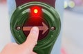 Pressing Pedestrian Crossing Button in Close-up View