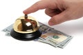 Pressing your finger call button hotel service and dollars white background.Concept hotel, travel and paid holidays