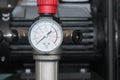 Pressure gauge on an air compressor close-up