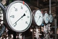 Pressure gauge is a close-up pressure measuring device in a row. Royalty Free Stock Photo