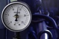 pressure gauge installed on hydraulic pump with motor, solenoid valve, pipe. in factory Royalty Free Stock Photo