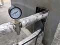 Pressure gauge and thermally insulated pipes on the pipeline