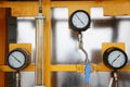 Pressure gauge using measure the pressure in production process. Worker or Operator monitoring oil and gas process by the gauge