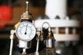 Pressure gauge using measure the pressure in production process. Worker or Operator monitoring oil and gas process by the gauge