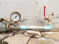 Pressure gauge and water tap Royalty Free Stock Photo