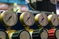 Pressure gauges with adjustment valves in industrial plant shop