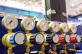 Pressure gauges with adjustment valves in industrial plant shop. Oxygen supply.