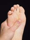 Pressure point massage under foot with thumb Royalty Free Stock Photo