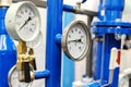 Pressure and temperature sensors in the water supply system. Mechanical barometer in an industrial boiler room. Close-up