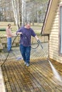 Pressure washing deck Royalty Free Stock Photo