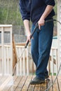 Pressure washing the deck Royalty Free Stock Photo