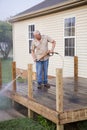 Pressure washing deck Royalty Free Stock Photo
