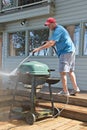 Pressure washing outdoor barbecue