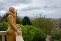 Chainsaw sculpture of a woman looking to the sea