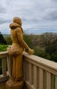 Chainsaw sculpture of a woman looking to the sea