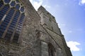 Presteigne church window, tower and yew tree in Powys, Wales.