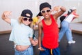 Preteen african boy and european girl hip hop dancers during group class