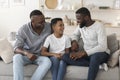 Preteen african boy spending time at home with grandfather and dad Royalty Free Stock Photo